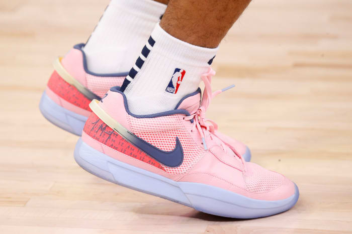 View of pink and blue Nike Ja shoes.